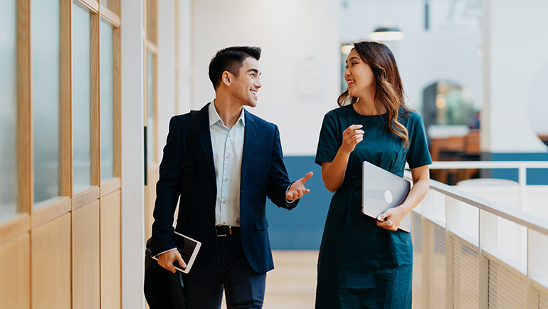 Businessman and woman talking